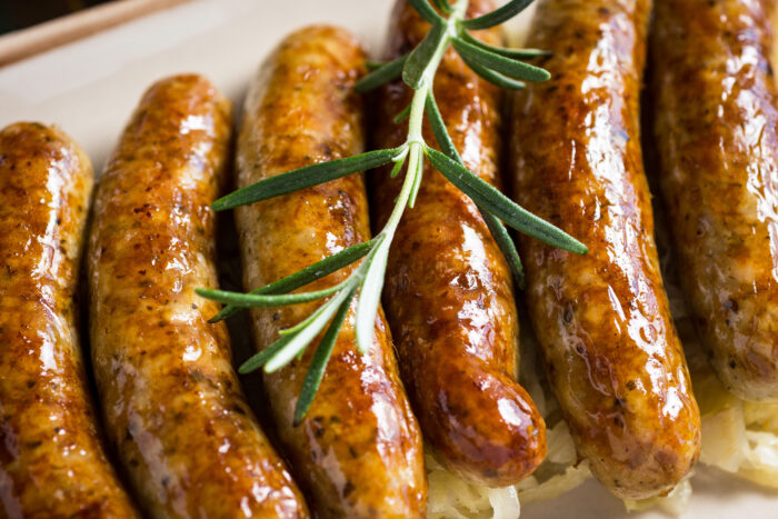 Juicy,grilled,sausages,with,cabbage,salad,,mustard,and,beer