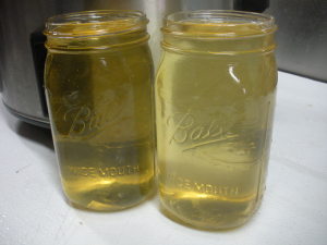 5 pounds of hog fat makes 2 quarts of rendered lard.  Lard will be yellow when it is hot.
